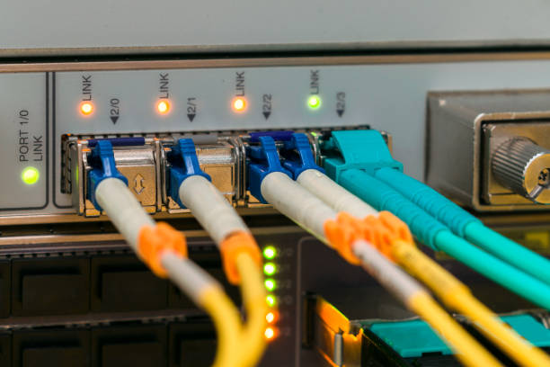 Backbone high-speed Internet communication channels. Fiber optic cables are connected to the interfaces of the central router. Modern equipment of the data processing center